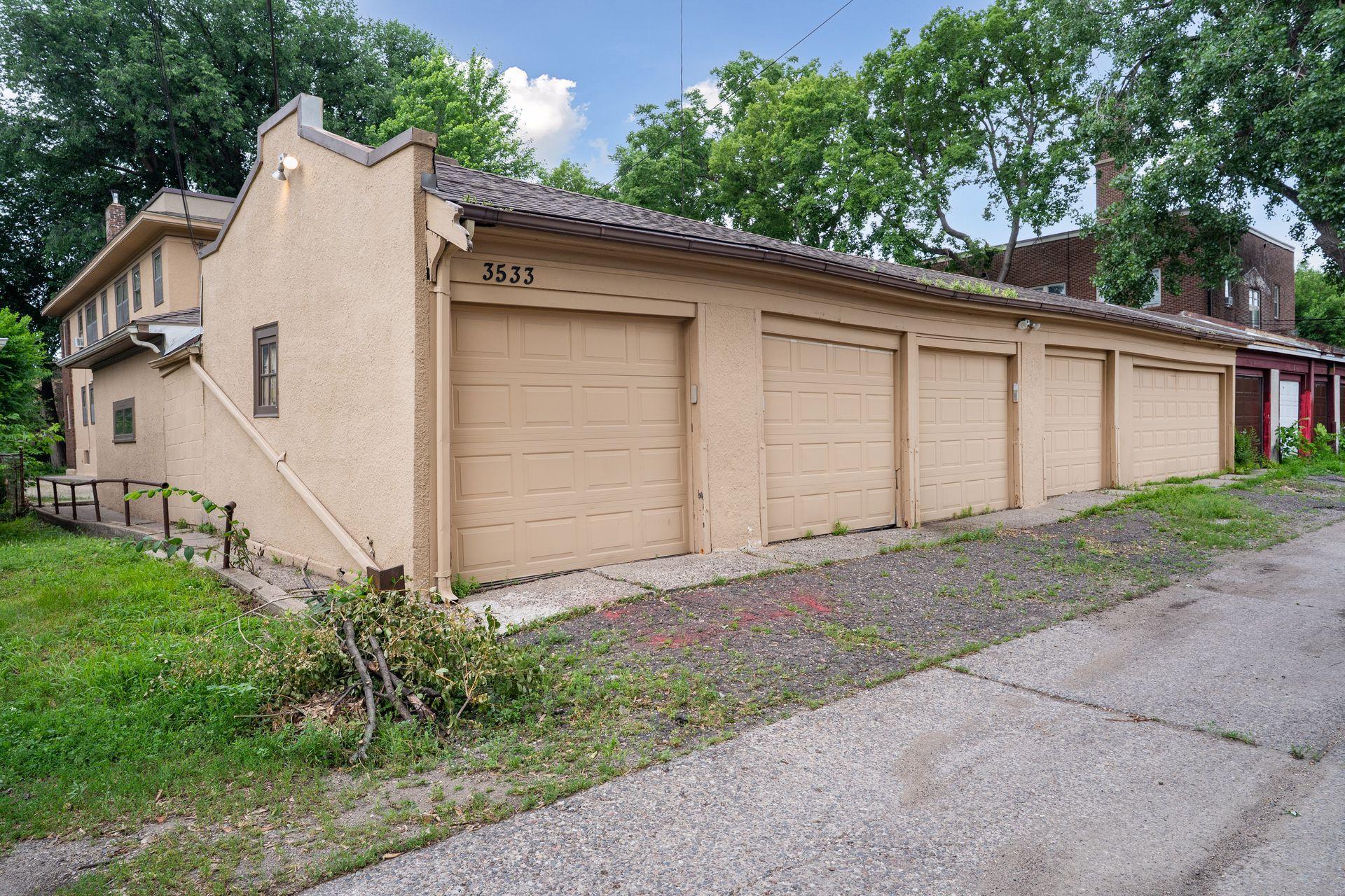Garages face the alley. This unit has 2 garage stalls plus 2 storage units in the basement by the laundry room.