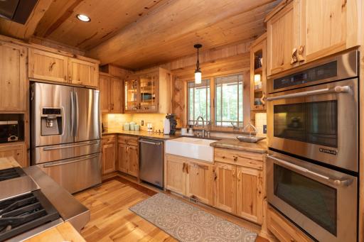 Double oven, gas stove, stainless appliances and farm sink