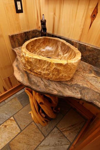 Main floor bath features petrified wood sink