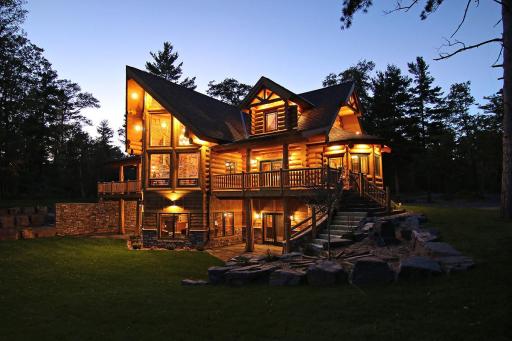 Twilight photo of the home looking from the lake