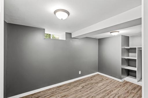 Downstairs, this finished bonus room is perfect for a home office, gym, craft room, and more!