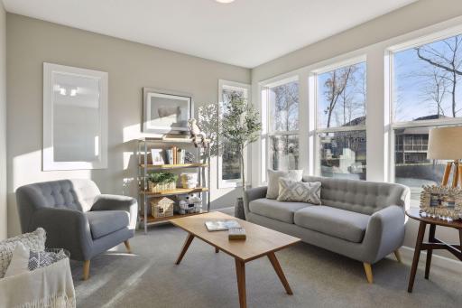 Just off the kitchen is the sun room. Use it as a reading nook or a place for your kids to play. (Pic of a previous model)