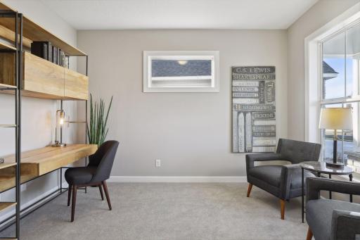 Just off the entry is a beautiful study, with views out the front of the home. (Pic of a previous model)