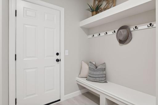The spacious mud room helps your home stay organized. (Pic of a previous model)