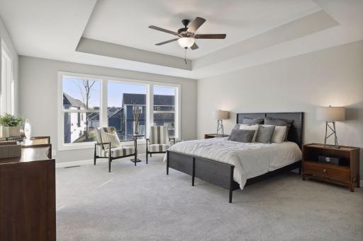Open the grand French doors into your very own owner's suite with a private bath. (Pic of a previous model)