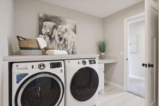 Having the laundry room near all the upper level bedrooms makes laundry day a little bit easier. (Pic of a previous model)