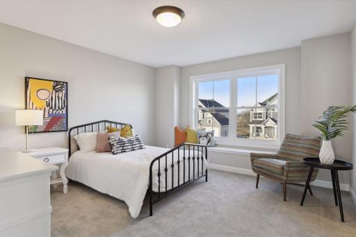 There are three additional bedrooms on the upper level as well as one on the lower level. (Pic of a previous model)