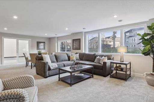 The lower level family room gives you addition living space. (Pic of a previous model)