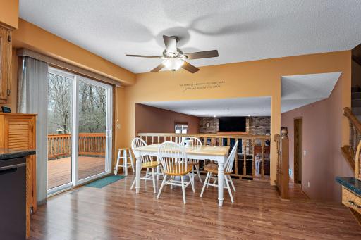 Informal dining area has walkout to oversized 2-level deck