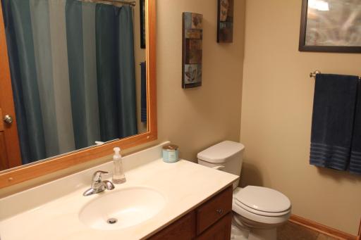 Upstairs full bathroom. Large vanity with a single sink. There is a linen closet behind the entry door to the bathroom with tons of room. Across the hall from the bathroom is also an additional linen closet.