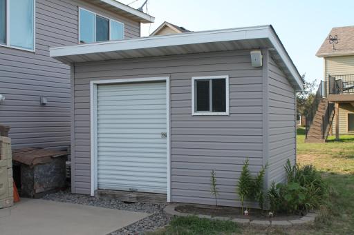 Shed out back is perfect for yard equipment or to store all the outdoor furniture/games. Matches the exterior finishes of the home and asphalt shingles. Tasteful landscaping all around the house.