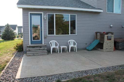 Large concrete patio with access from the living room. There is also an exterior power outlet for hosting the perfect gathering.