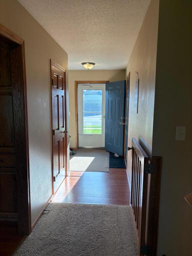 Spacious foyer that is inviting. A closet completes the entry way. Can either walk straight down the hallway to the remainder of the interior or take a turn right into the spacious kitchen area.