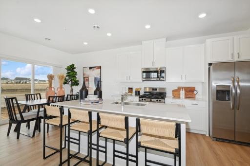 (Photo of model home) Socialize while making your favorite meal!