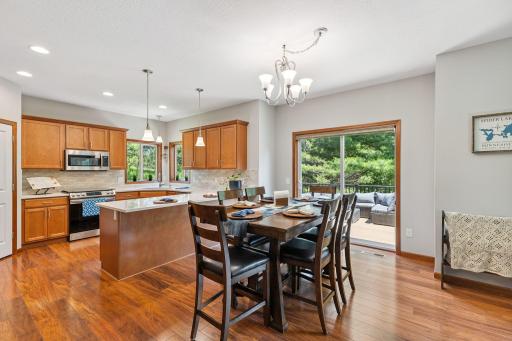 The informal dining room is always full of light and a view of the lake thanks to the sliding glass door.