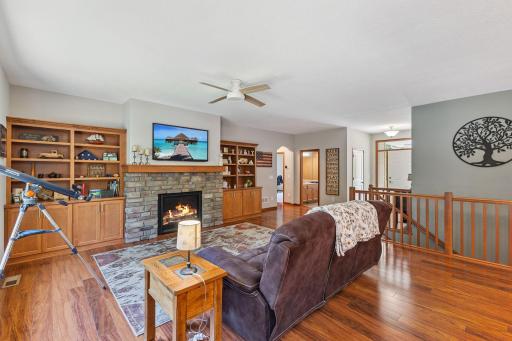 Built-ins flank the fireplace and with both shelving for decor, but also cabinets for storage.