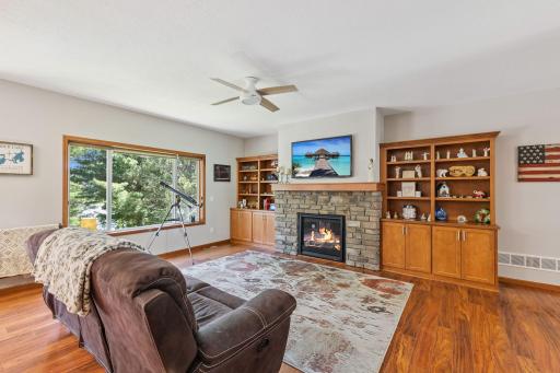 The living room has a cozy fireplace for those MN winter nights.