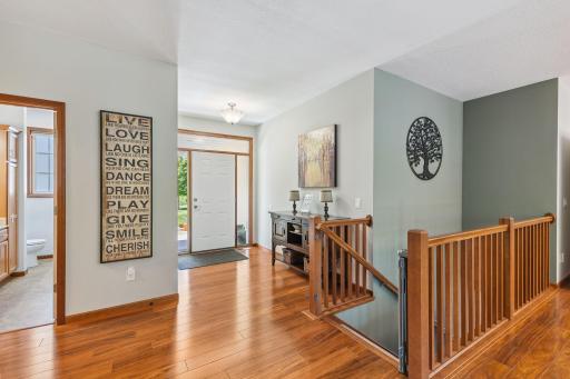 The foyer is bright as the front door is flanked with windows.
