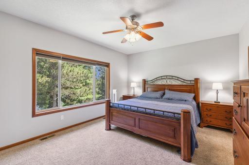 The primary bedroom is on the main floor at the back of the house giving the opportunity to wake up to a breathtaking view each morning!