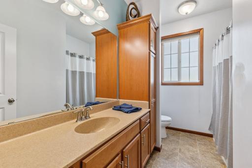 The main floor bath is a full bath with plenty of storage.