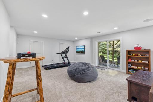 This space is plenty big enough to add entertainment pieces like a pool or ping pong table, or a full home gym.