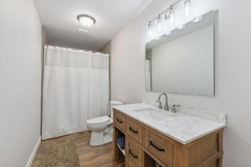 The new lower-level bath is beautifully finished with a full shower.