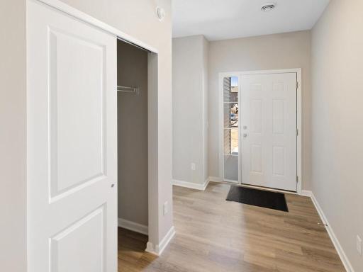 Foyer. Photo taken of another home with similar plan and finishes. Photos and renderings may not depict actual plan, materials, & finishes may vary. All measurements are approximate.