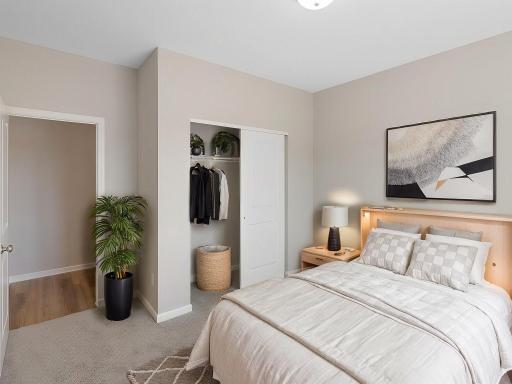 Bedroom 2, Virtually Staged. Photo taken of another home with similar plan and finishes. Photos and renderings may not depict actual plan, materials, & finishes may vary. All measurements are approximate.