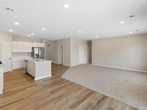 Dining Room. Photo taken of another home with similar plan and finishes. Photos and renderings may not depict actual plan, materials, & finishes may vary. All measurements are approximate.