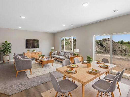 Dining Room, Virtually Staged. Photo taken of another home with similar plan and finishes. Photos and renderings may not depict actual plan, materials, & finishes may vary. All measurements are approximate.