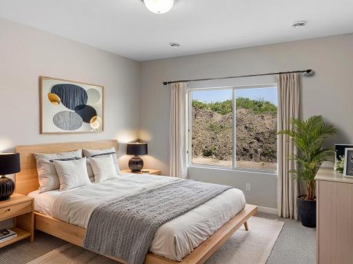 Primary Suite, Virtually Staged. Photo taken of another home with similar plan and finishes. Photos and renderings may not depict actual plan, materials, & finishes may vary. All measurements are approximate.