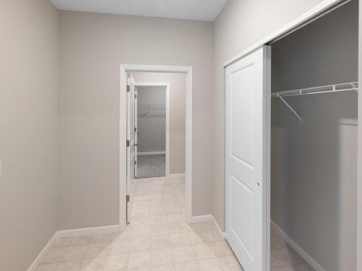 Mudroom. Photo taken of another home with similar plan and finishes. Photos and renderings may not depict actual plan, materials, & finishes may vary. All measurements are approximate.