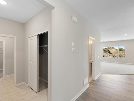 Mudroom. Photo taken of another home with similar plan and finishes. Photos and renderings may not depict actual plan, materials, & finishes may vary. All measurements are approximate.