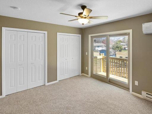 The primary bedroom has a walkout to the deck + backyard.