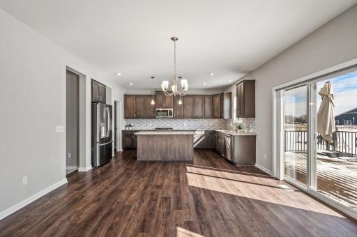 Stainless steel appliances with patio off of eat in area