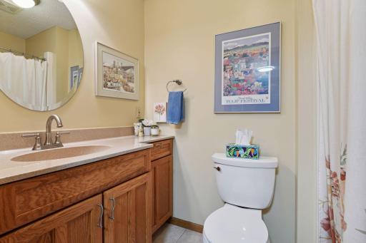 Main level 3/4th bath with walk in shower directly located off back entry and the bonus room space or main level primary.