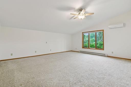 Main level primary bedroom is huge with additional AC wall unit. This also is a flex space if your seeking a bonus room on main. Multi purpose for so many options.