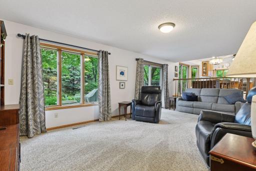 View of main level family room and kitchen as you walk in from the garage and back entry.