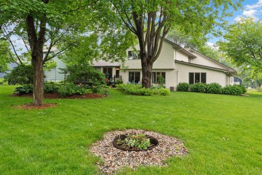 View from playhouse or garden shed. Enjoy the firepit for gatherings year round. Viewing towards ML bedroom or multipurpose room on right side of home.