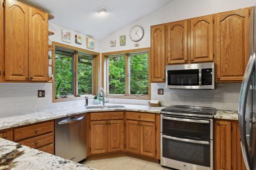 New undermount sink and faucet with great windows out towards the backyard with privacy.