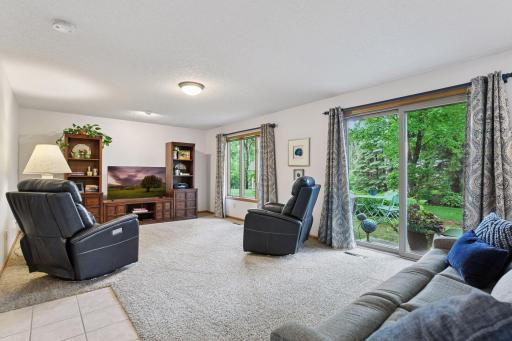 Family room on main with another sliding door to access 2nd patio and the lush landscaped backyard for hours of enjoyment to garden, do flowers and just appreciate the quiet setting.