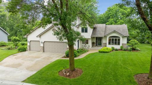 Beautiful updated home in Waconia on lush private lot with incredible yard backing to paved walking paths.