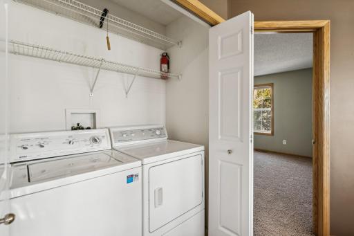 Upstairs laundry with new washing machine.