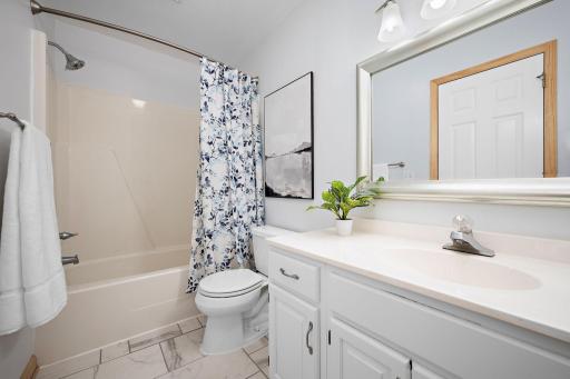 Main level full bath with new tile floors!