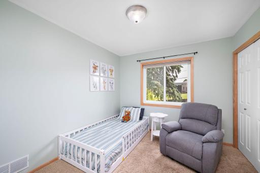 Second bedroom on the upper level has a large window for natural light and a large closet with all new shelving!
