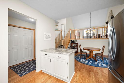 Warm and welcoming views of the home from the kitchen show the open upper level with an amazing vaulted ceiling!