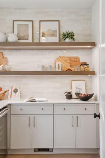 Butlerâs pantry tucked behind the scenes for seamless hosting.