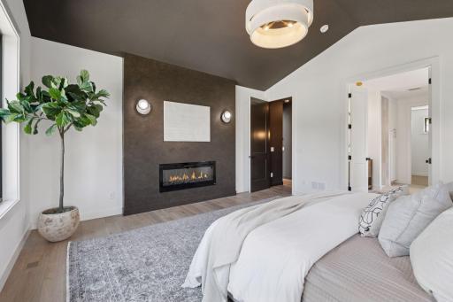 Main level primary suite designed with elegant comfort in mind.