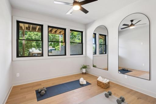 The dedicated fitness studio features wide plank flooring, oversized mirrors, and energizing natural lightâdesigned to elevate your daily routine.