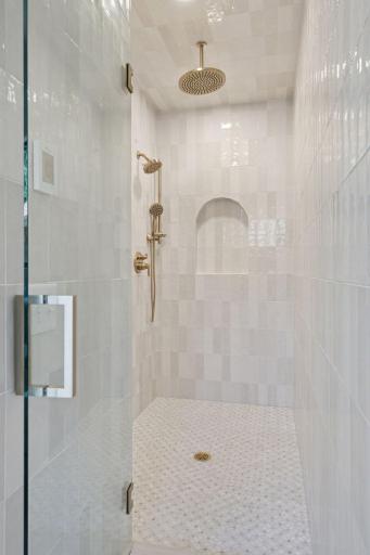 4404 West 58th Street - Primary Suite Walk in Serenty Shower with Custom Tilework & Designer Arched Alcove.jpg